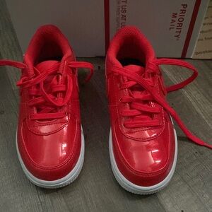 Bright red kids nikes